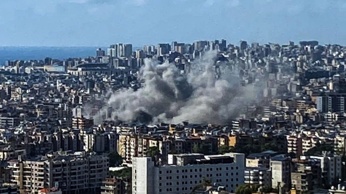 Smoke rises above the southern suburbs of Beirut after an Israeli strike on Sept. 20, 2024.