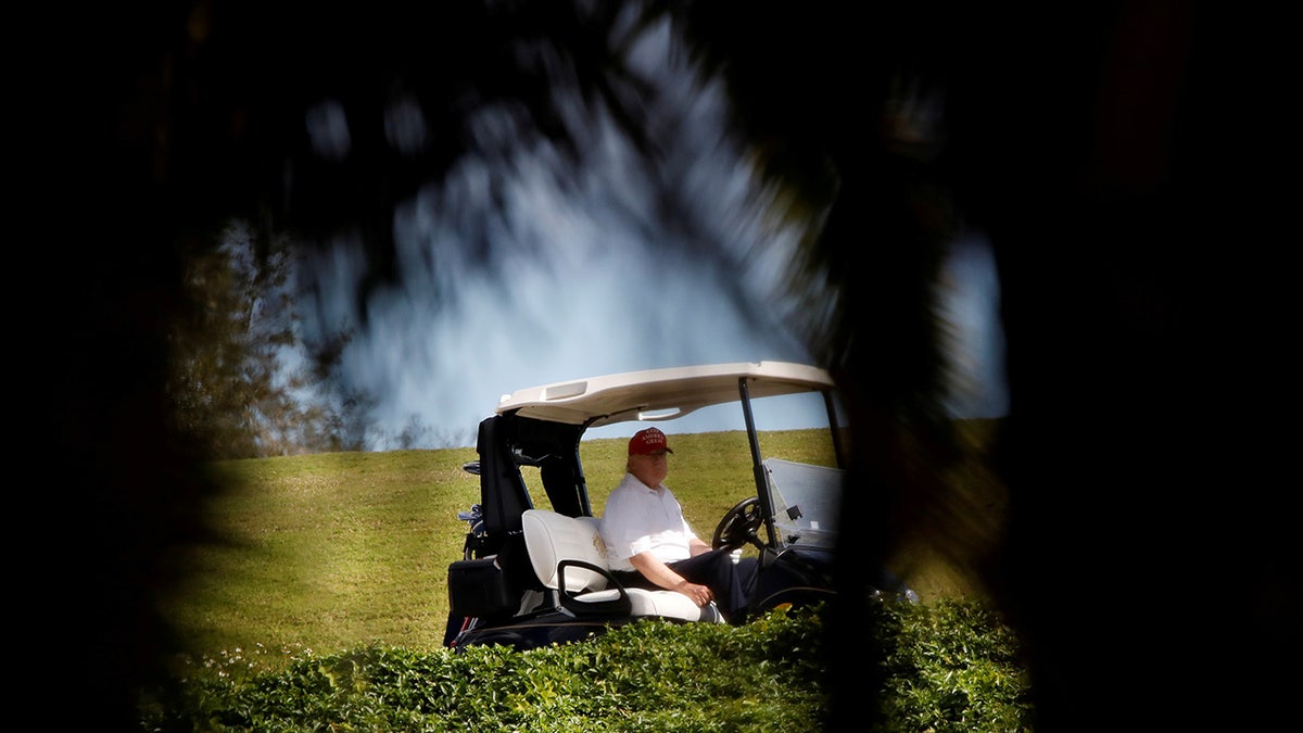 Donald Trump plays golf at the Trump International Golf Club in West Palm Beach