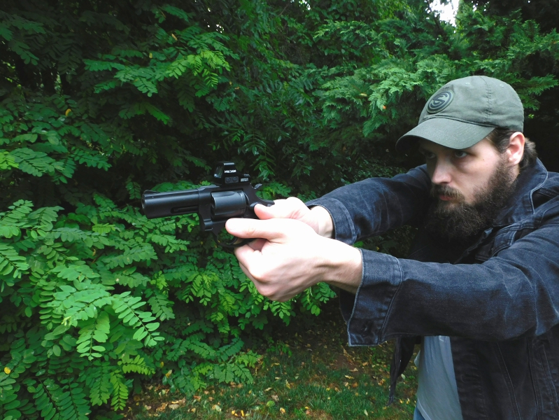 Man firing a revolver