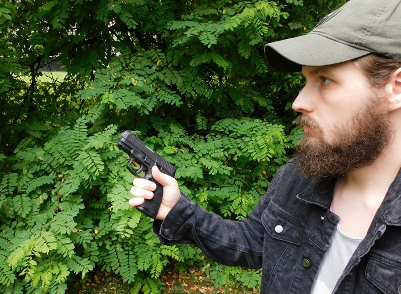 Man holding a concealed carry pistol