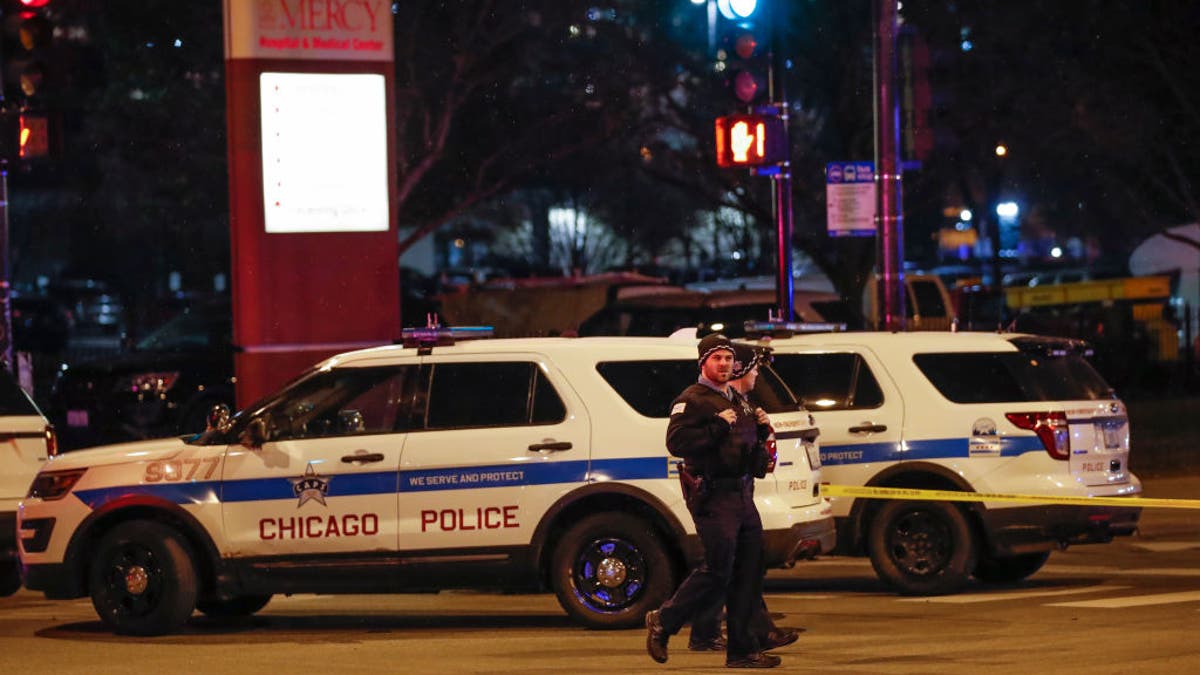 Chicago Police officers monitor the area outside of the Chicago Mercy Hospital where a gunman opened fire in Chicago on November 19, 2018. 