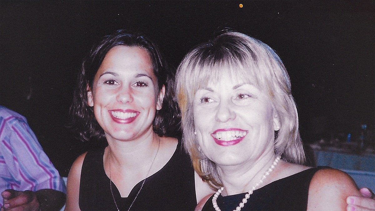 Laci Peterson and Sharon Rocha smile in an old photograph, both wearing black