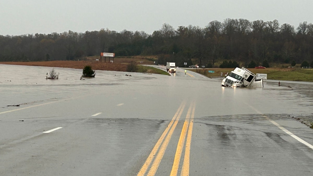 In a photo released by the Missouri State Highway Patrol, tractor trailer sits submerged in flood water on US 63 just north of Cabool, Mo., Tuesday, Nov. 5, 2024.