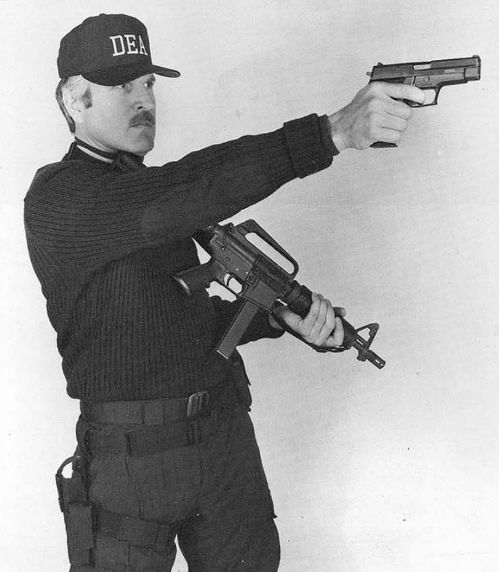 DEA agent with Colt SMG