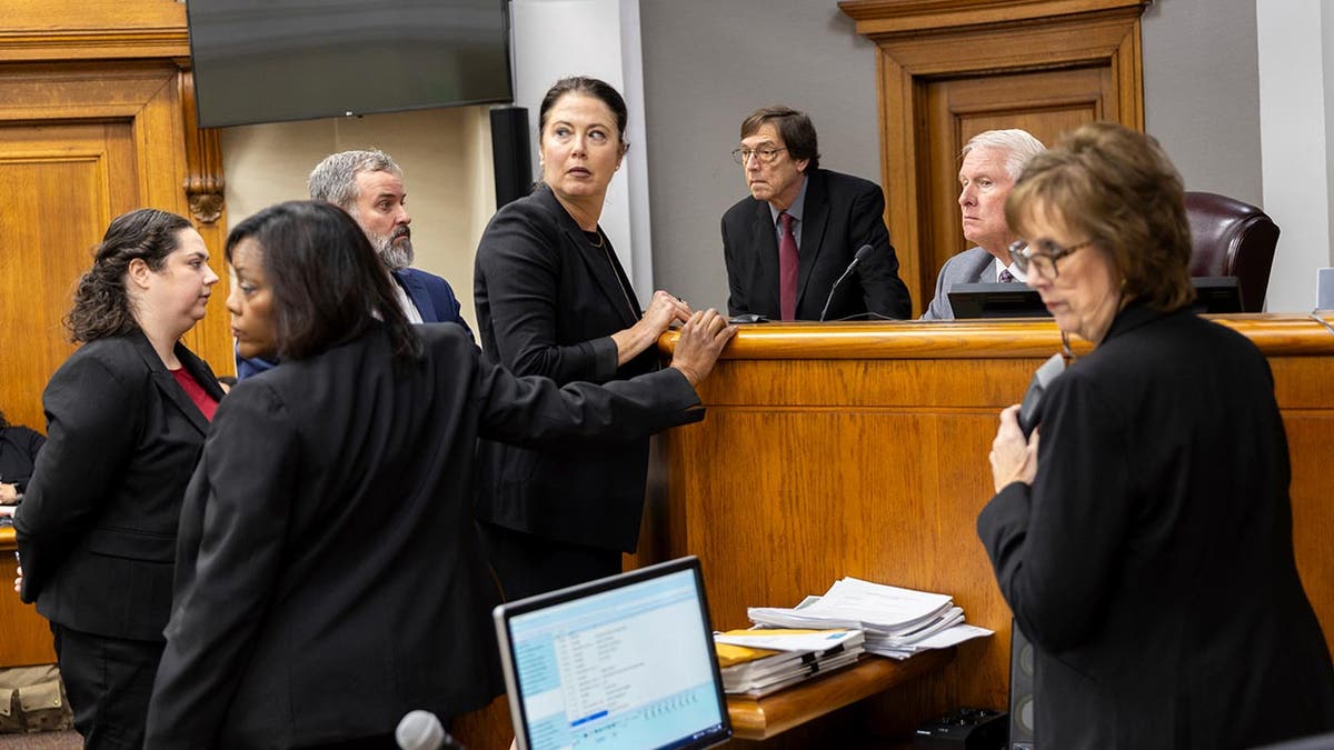 Prosecutors and defense meet with Judge H. Patrick Haggard during Jose Ibarra's trial at the Athens-Clarke County Superior Court, Tuesday, Nov. 19, 2024, in Athens, Ga.