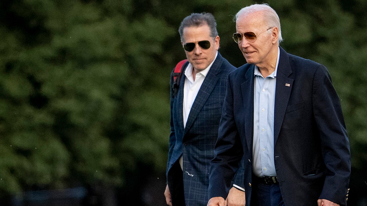 President Biden walking with son Hunter, left