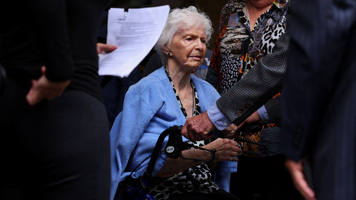 Joan Andersen VanderMolen, sister of Kitty Menendez, looks on as family members of Erik and Lyle Menendez hold a press conference