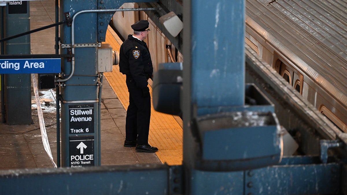 Police officer on subway platform