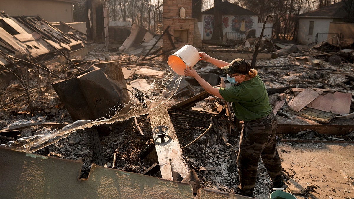 Woman trying to put fire out