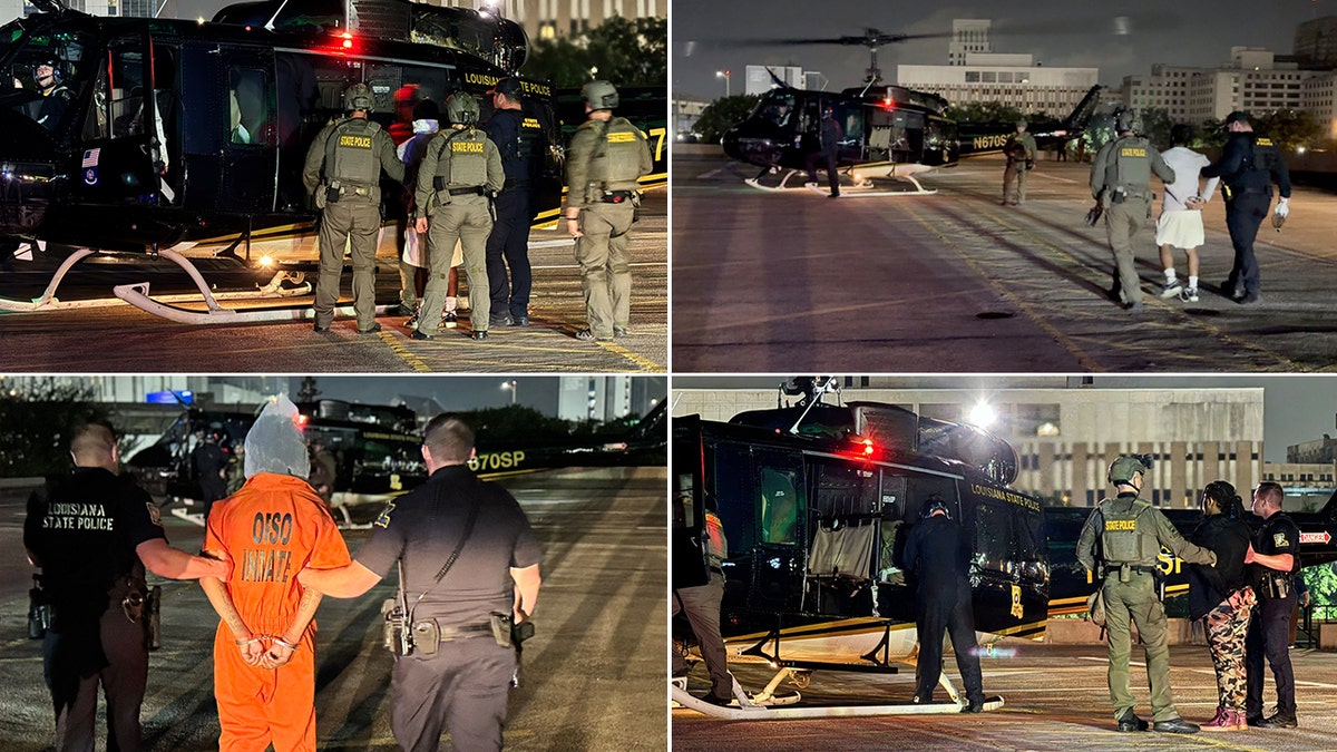 The captured inmates being led to a helicopter.