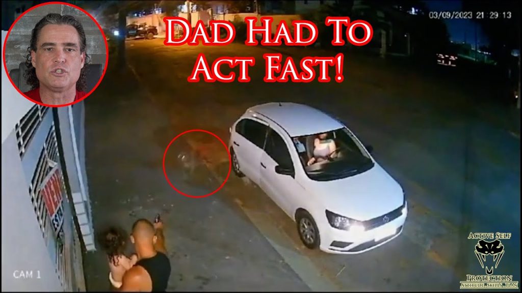 Dad Has Split Second To Protect Himself And His Baby From Charging Dog