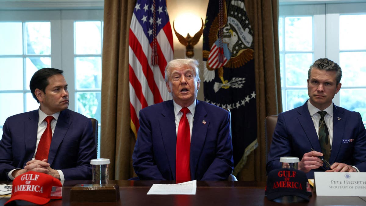 U.S. President Donald Trump speaks next to U.S. Defense Secretary Pete Hegseth and U.S. Secretary of State Marco Rubio