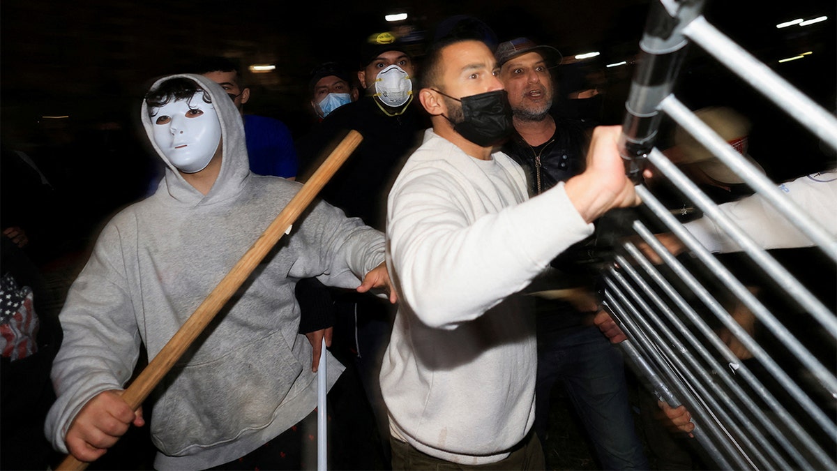 Police arrest a student during protests at UCLA
