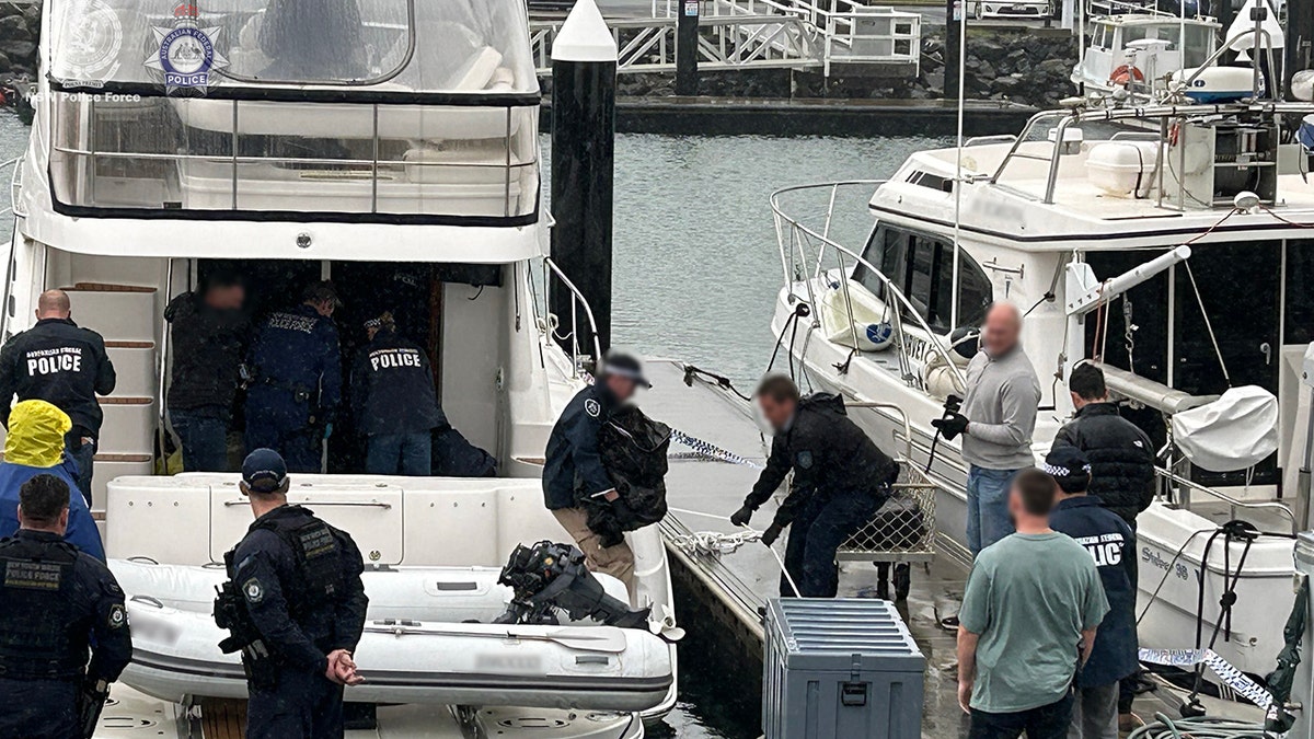 authorities seizing cocaine off boat