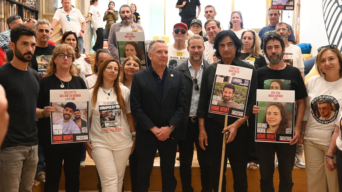 Adam Boehler and Steve Witkoff with the families of hostages