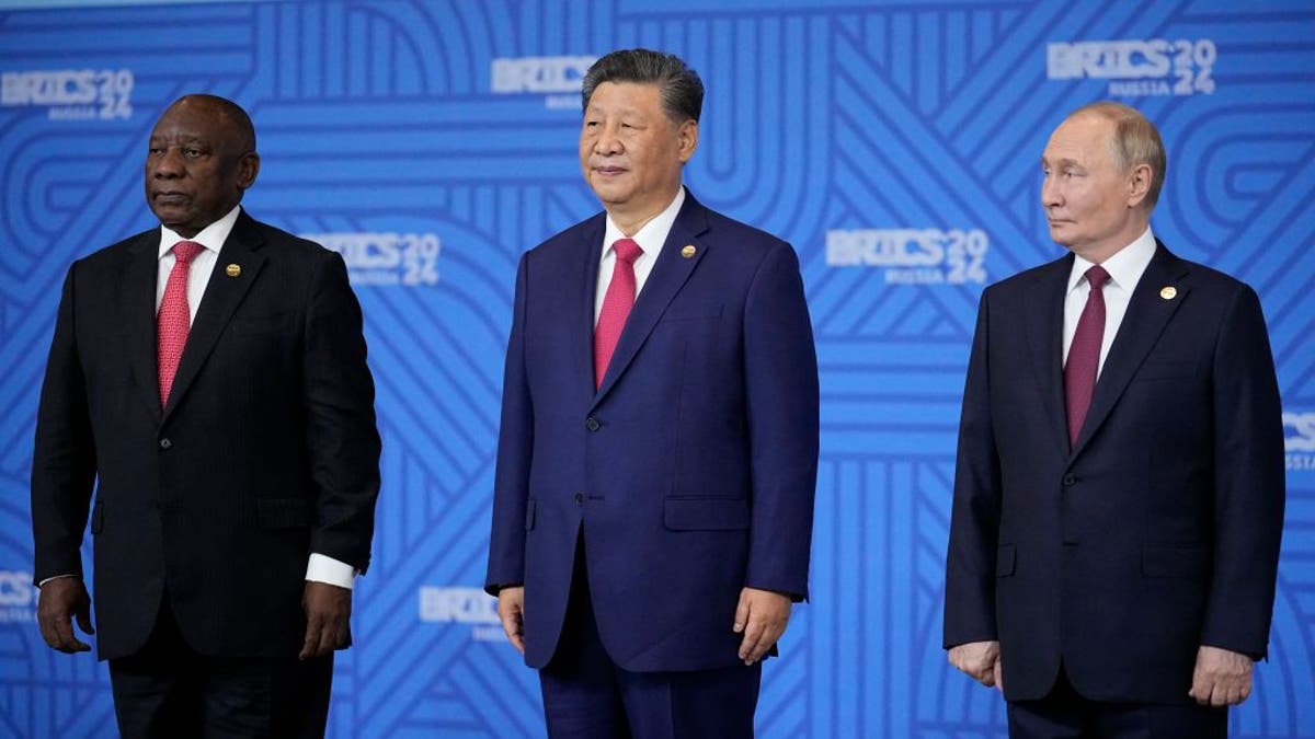 South African President Cyril Ramaphosa, left, Chinese President Xi Jinping and Russian President Vladimir Putin