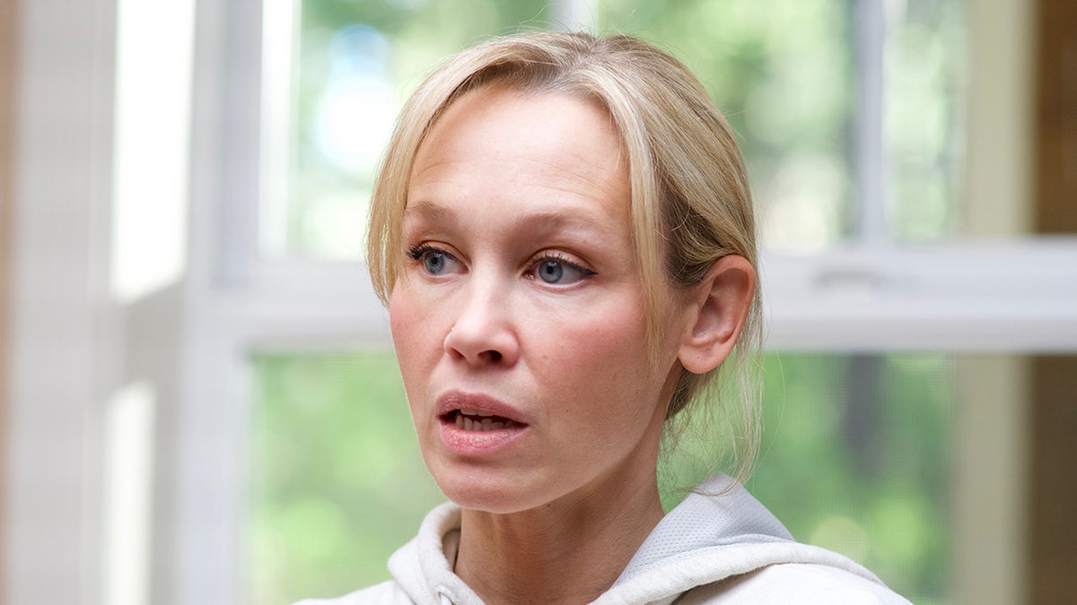 A close-up of Sherri Papini wearing a white sweatshirt.