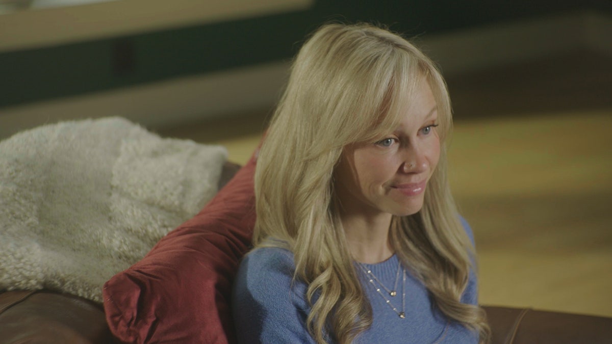 Sherri Papini looking away from the camera and wearing a periwinkle sweater.