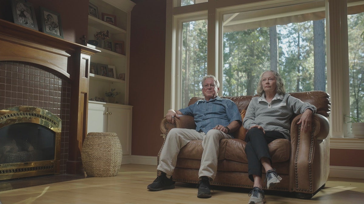 Sherri Papini's parents sitting together on a couch.