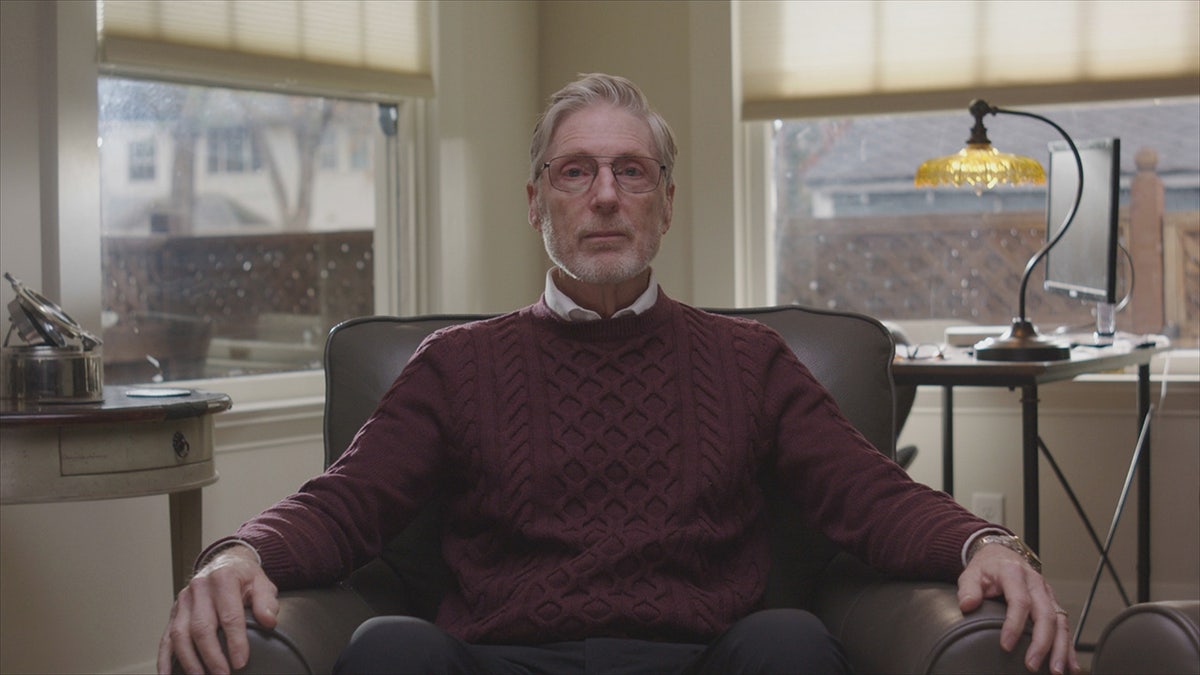 Dr. Steve Diggs wearing a burgundy sweater.