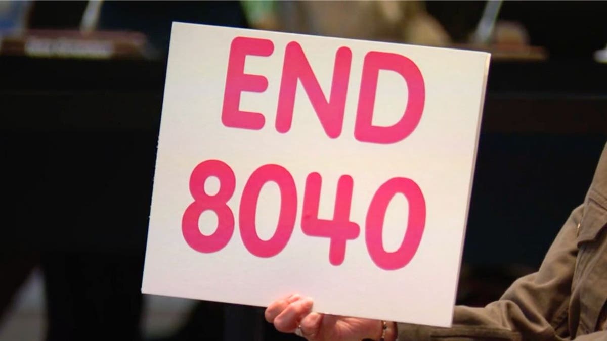 End 8040 protest sign
