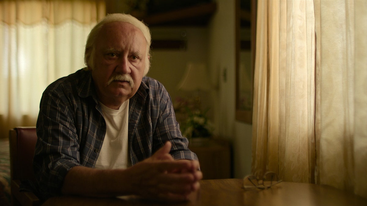 A close-up of Joseph Janus speaking to Netflix cameras.