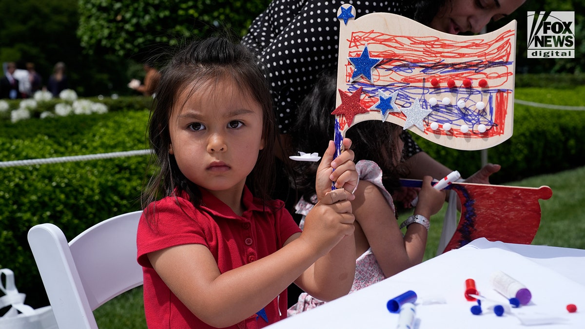 Children in the White House garden for an event hosted by FLOTUS.