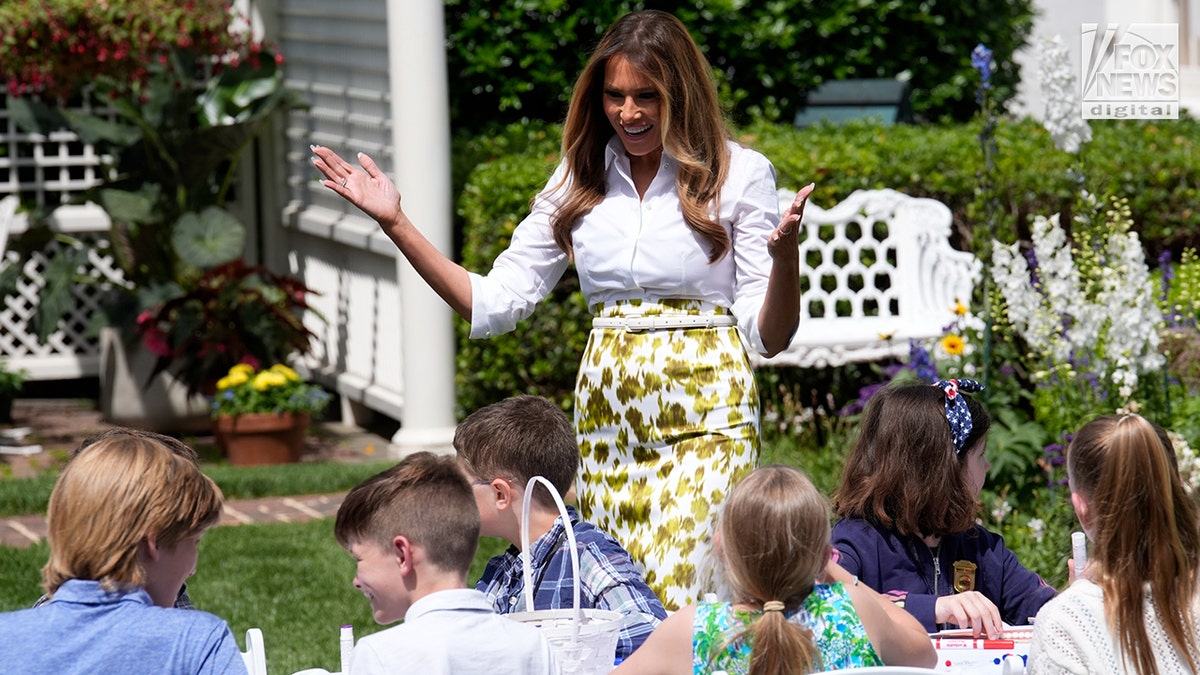 FLOTUS with children in the White House garden.