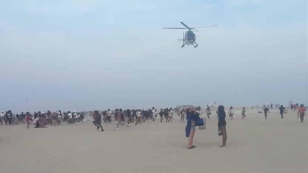 Hundreds of teenagers transform peaceful beach into chaos as police forced to break up fights