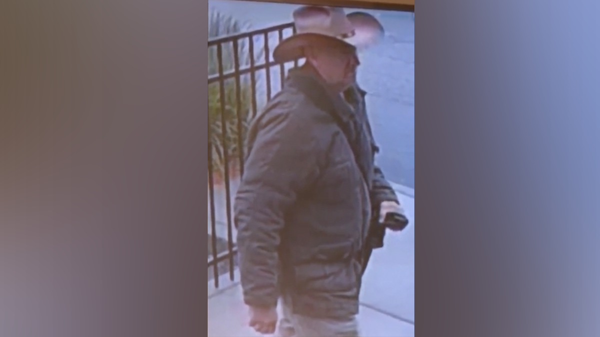 Vance Luther Boelter wearing a cowboy hat and jacket