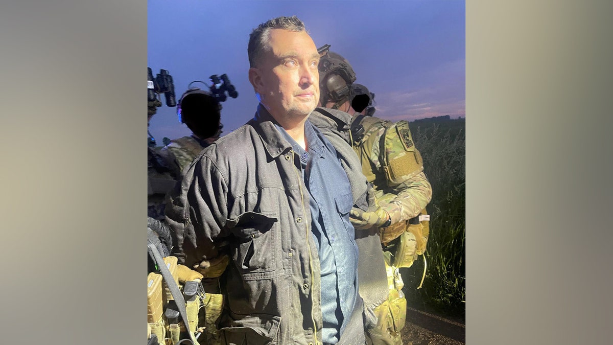 Vance Luther Boelter being arrested