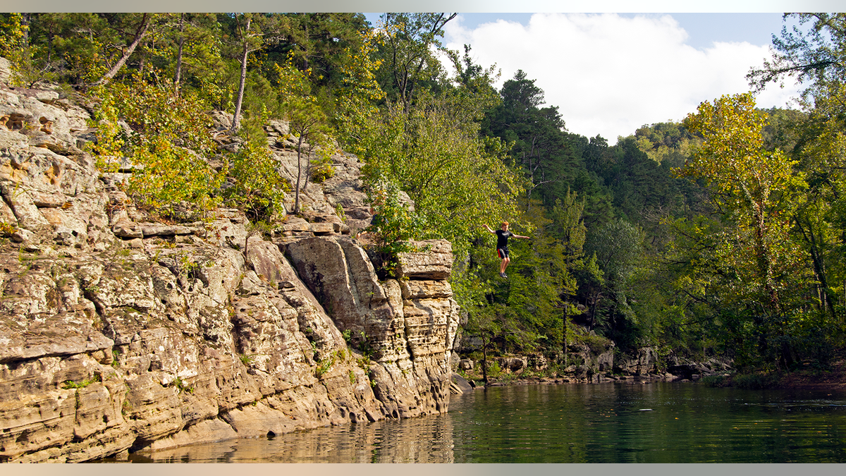 Boy jumps into Arkansas river
