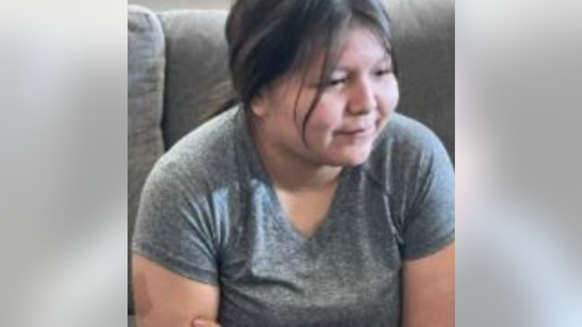 Emily Pike on a couch