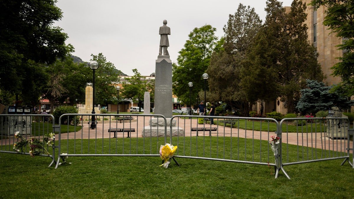 Flowers on police barricades outside the Boulder County Courthouse