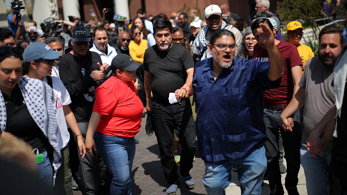 David Huerta walks in socks