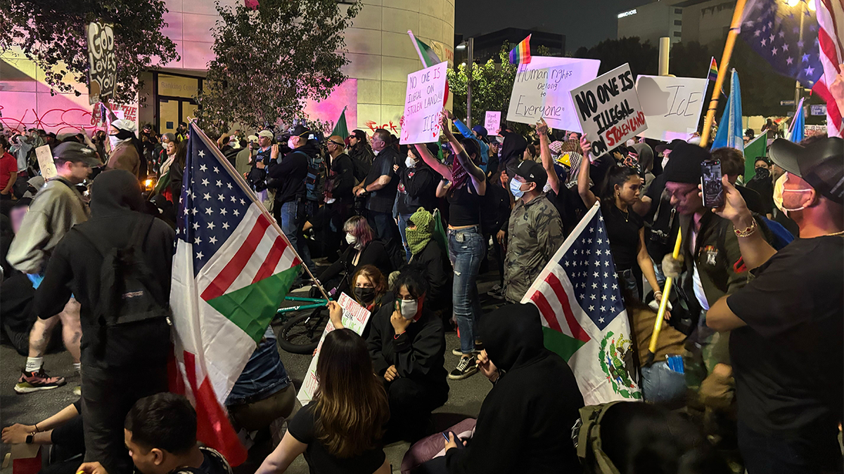 Anti-ICE protestors block an intersection in downtown Los Angeles