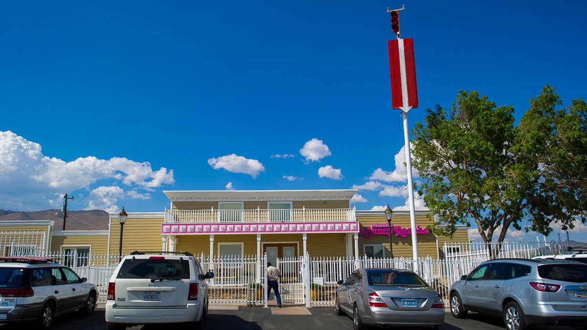 The Moonlite Bunny Ranch with cars parked outside.