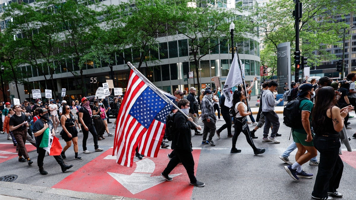 Demonstrators protest against US Immigration and Customs Enforcement (ICE) in response to federal immigration operations, in Chicago, Illinois, on June 10, 2025.