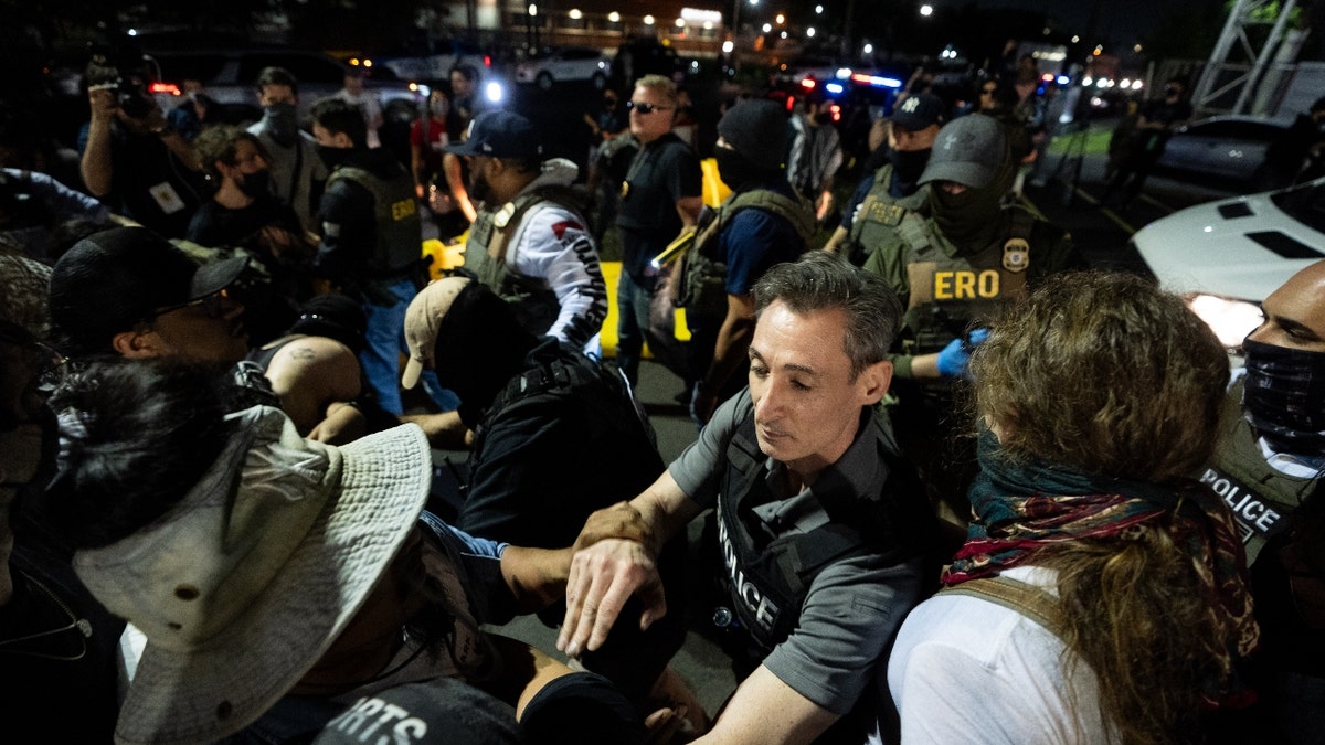 Protesters block vehicles from entering or leaving the Delaney Hall ICE facility following the reported escape of four migrants in Newark, United States, on June 12, 2025.