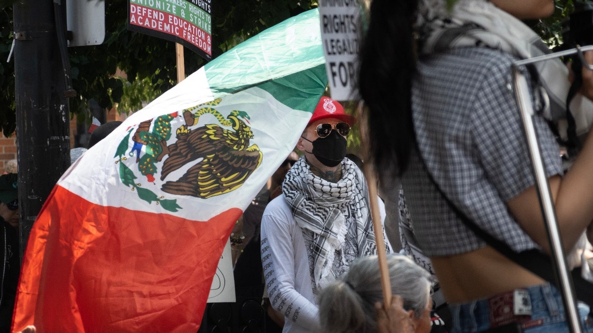 Demonstrators gather in the predominately Hispanic Pilsen neighborhood to protest recent ICE raids in the city on June 08, 2025 in Chicago, Illinois.
