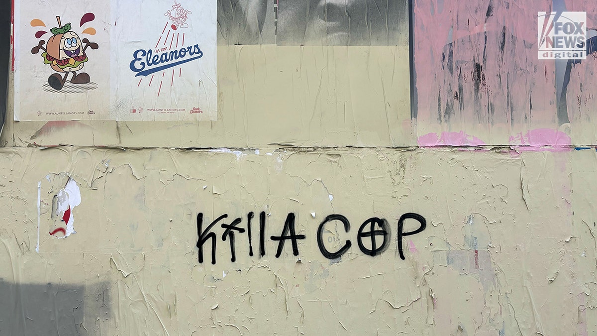 Violent anti-police messaging spray painted on building in downtown Los Angeles