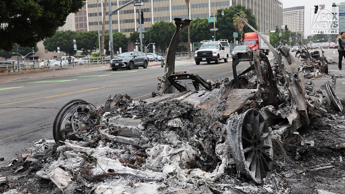 Burned-out Waymo cars line a street in downtown Los Angeles on June 9, 2025. Rioters set the vehicles ablaze the previous night.