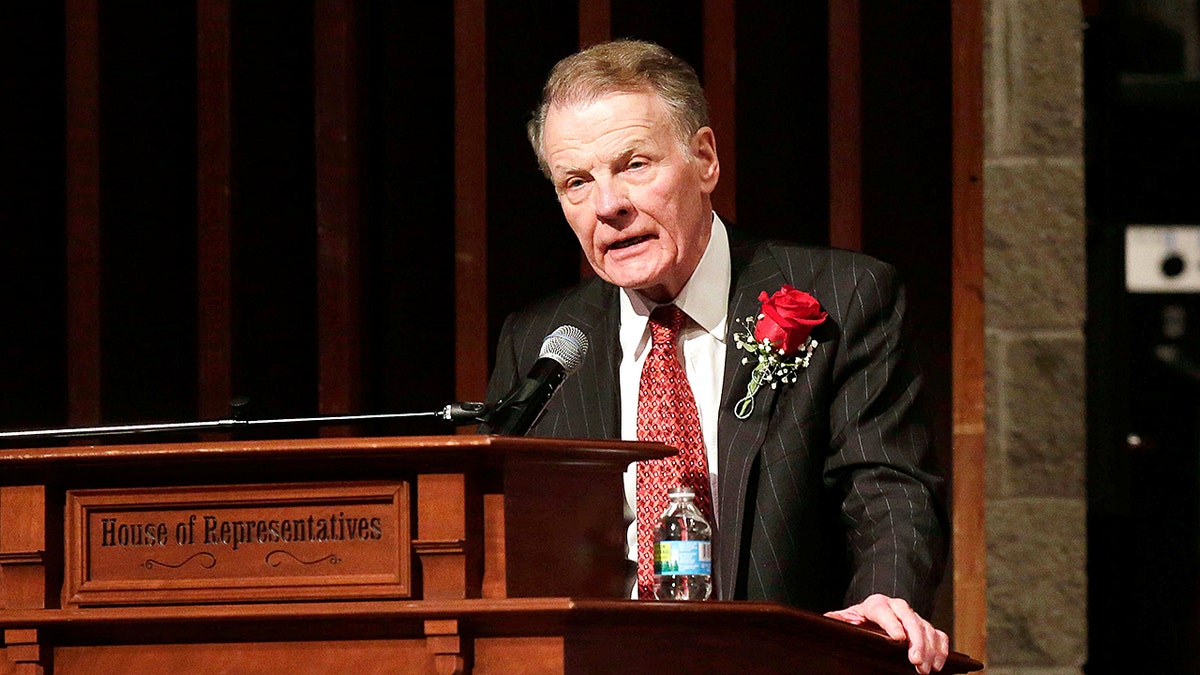 Michael Madigan behind a podium that says House of Representatives