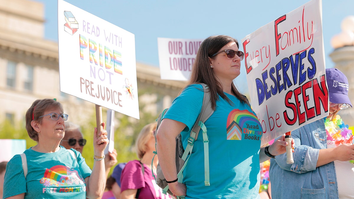 LGBTQ protesters holding signs