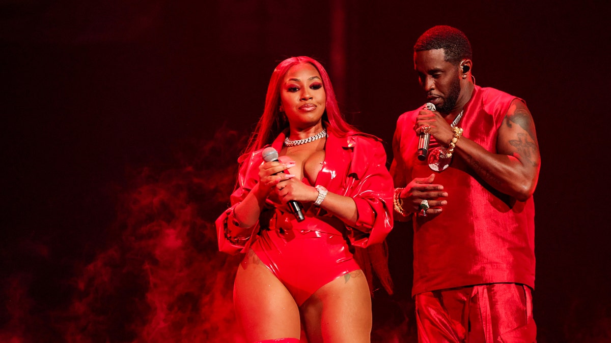 Yung Miami and Diddy on stage