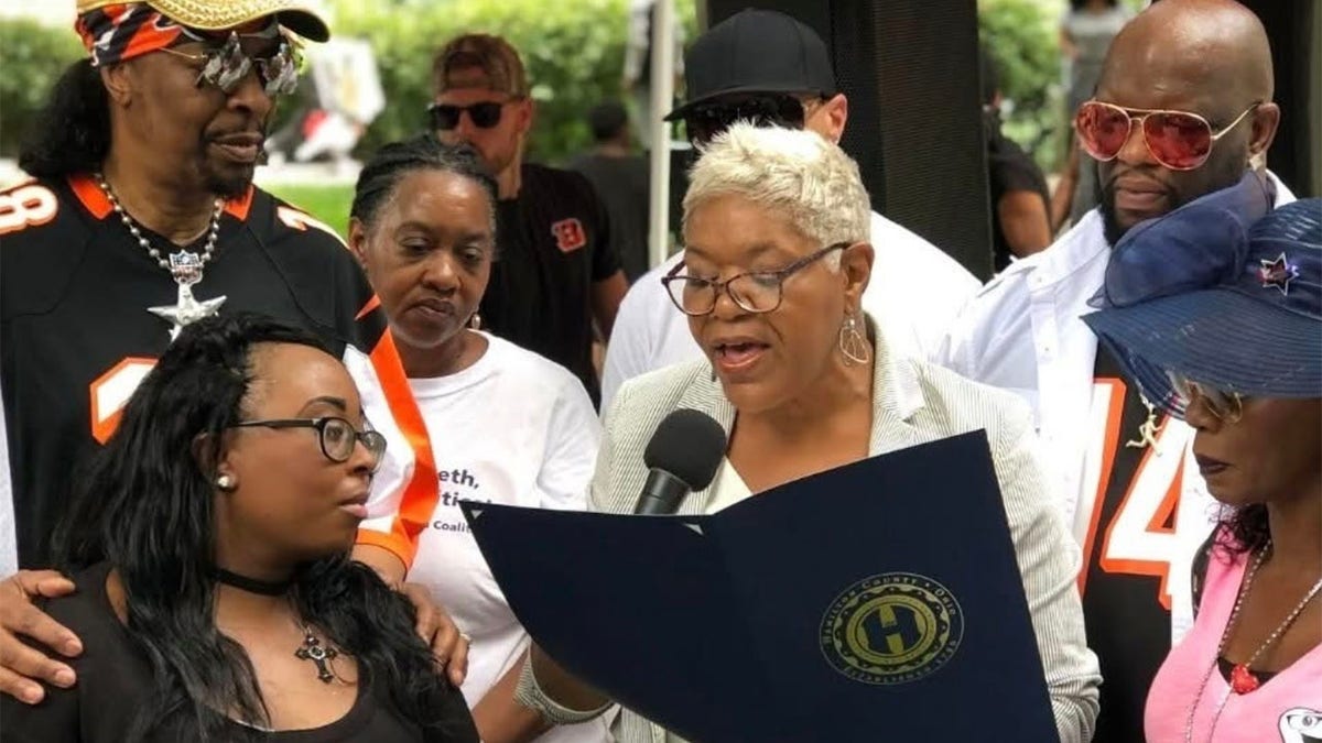 Victoria Parks cincinnati speaks into microphone