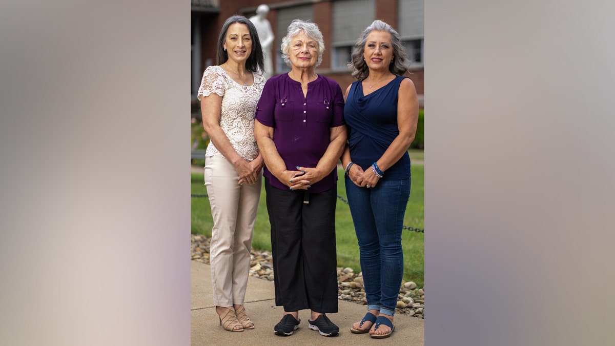 Dawn Comperatore-Schafer, Karen Schafer Bird, Kelly Comperatore-Meeder (L-R) the mother and sister of Corey Comperatore the Donald Trump assignation victim pose for a portrait in Pittsburgh, PA, U.S., July 8, 2025.