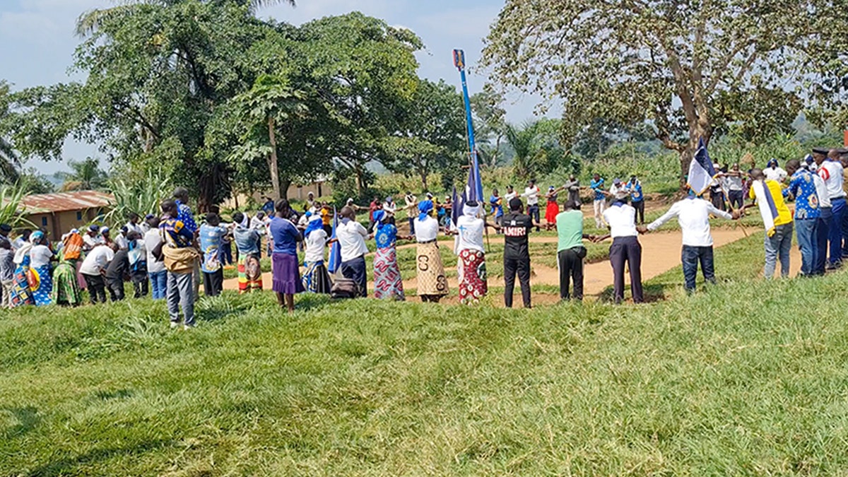 Villagers pray together for the 49 Christians killed last Sunday in the Democratic Republic of Congo by ISIS-linked extremists.