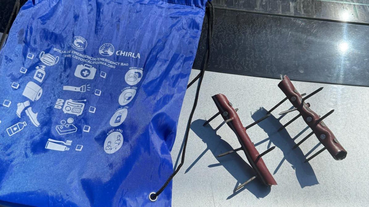 two nails device displayed on table