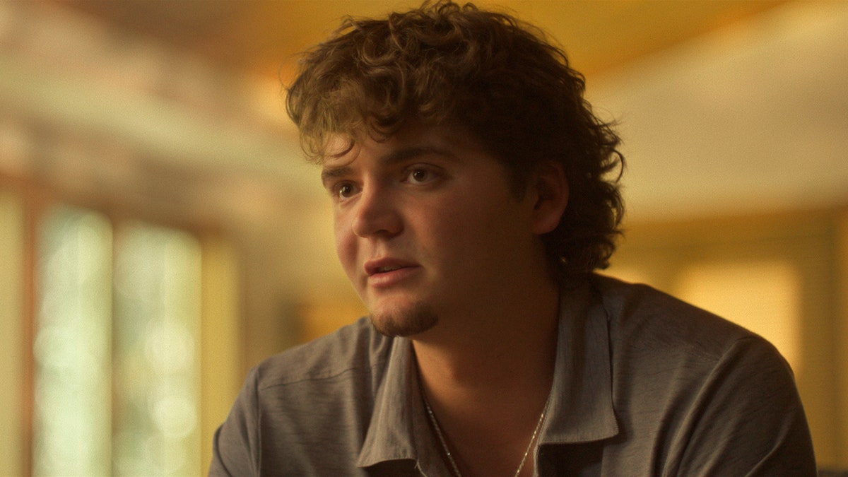 Hunter Chapin wearing a grey polo shirt.